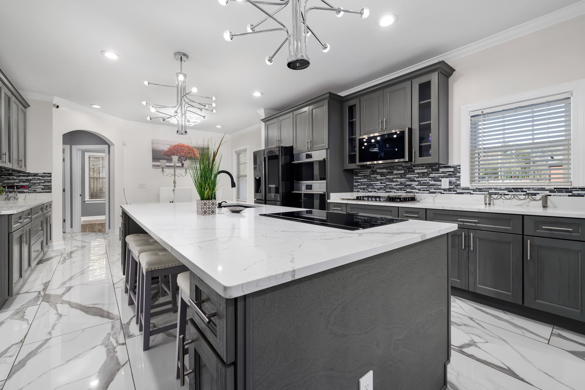 Luxury modern kitchen with painted cabinetry, illustrating cabinet painting cost in Port St Lucie