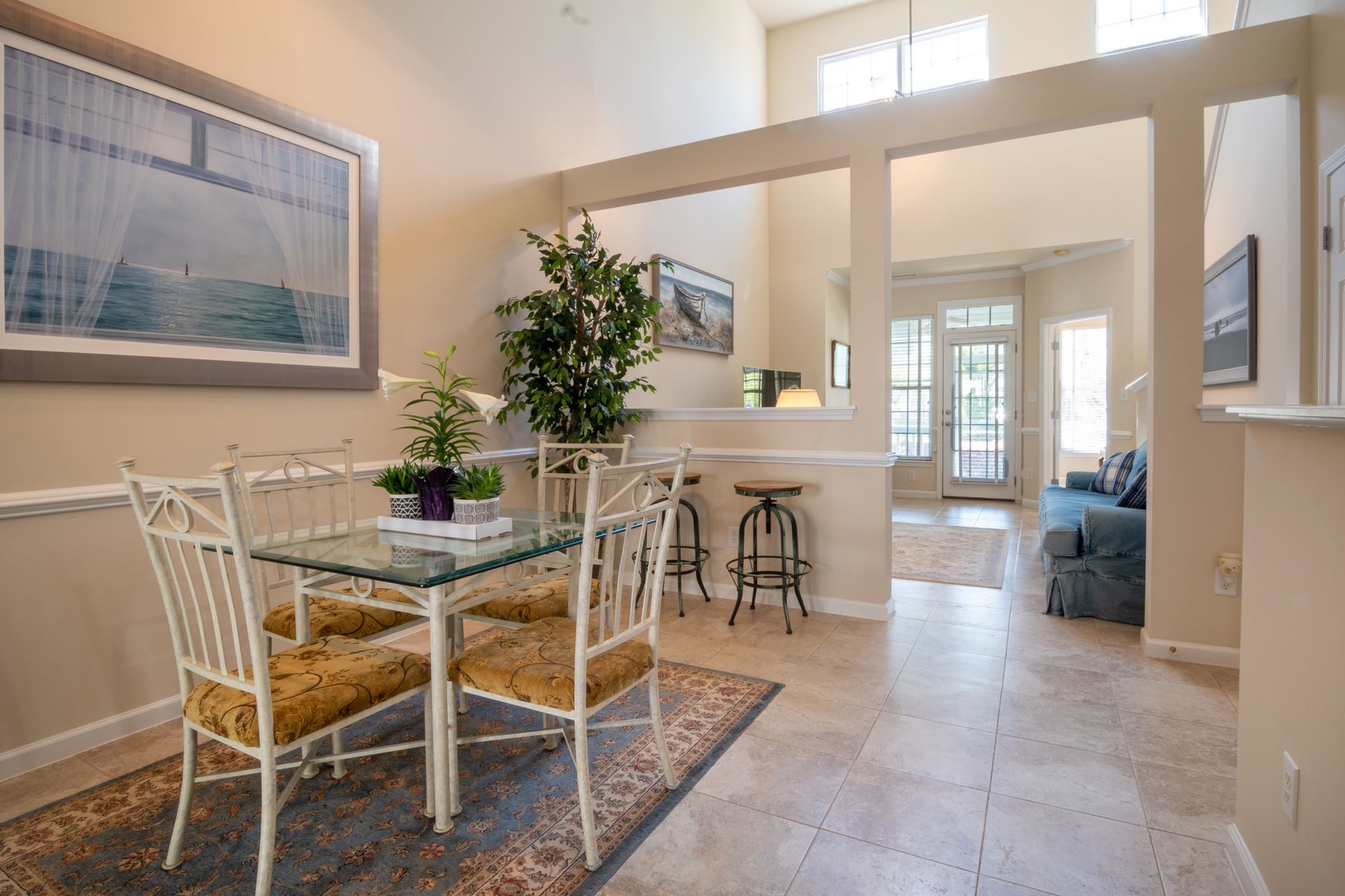 Bright open-concept living and dining area with freshly painted walls and ceilings in a Port St Lucie home